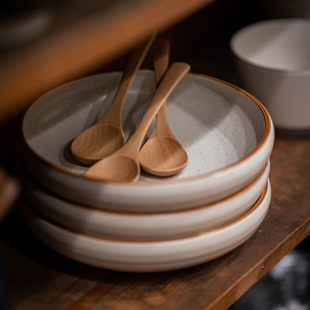 Set of two plates with wooden spoon