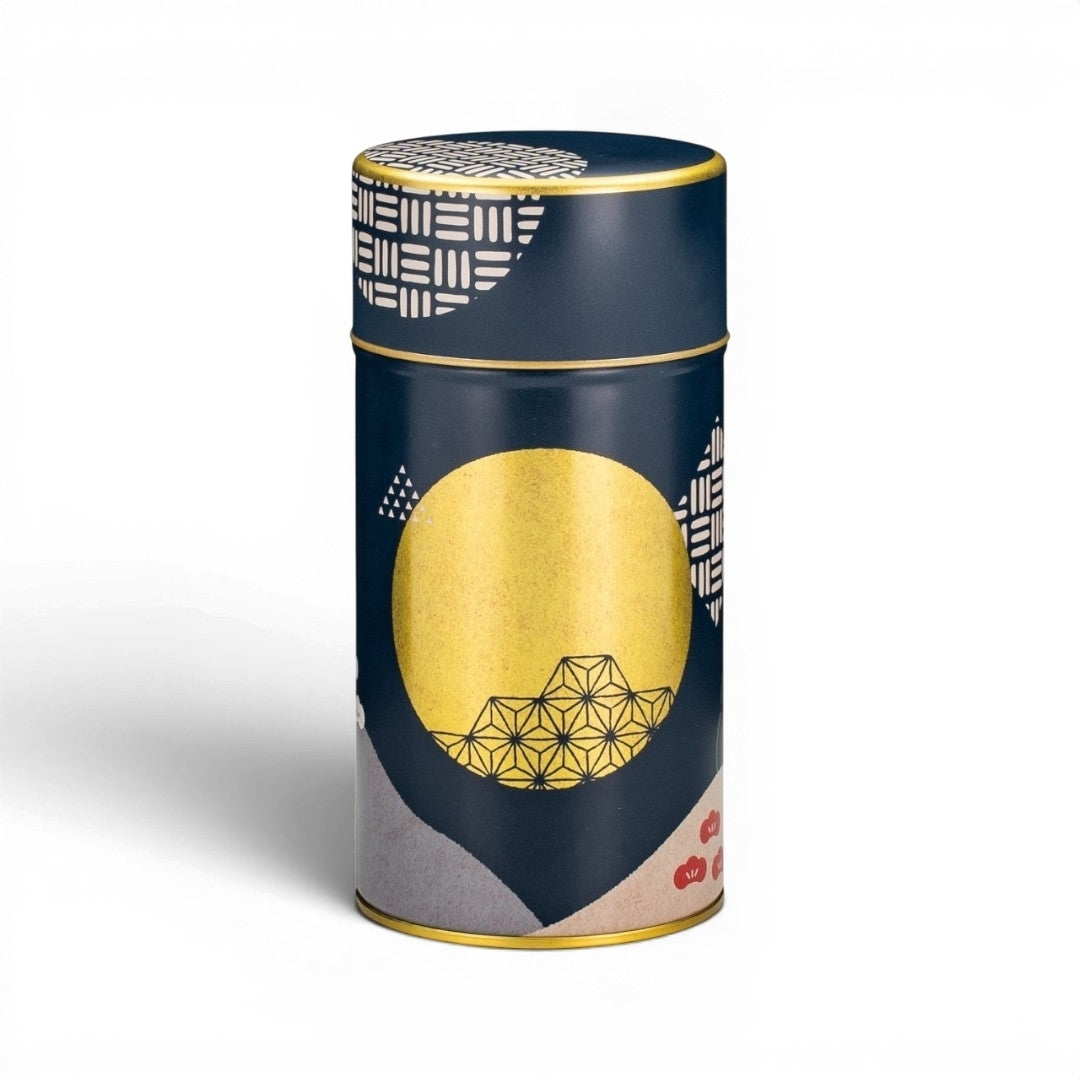 Boîte à thé cylindrique Yugen lab Tsukihi en fer blanc et papier washi bleu navy avec motifs géométriques dorés