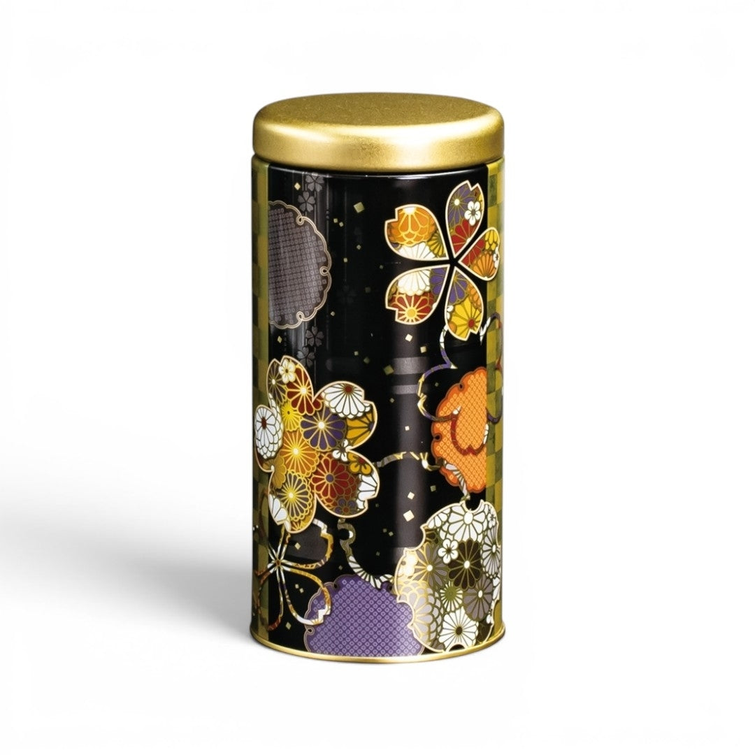 Boîte à thé Yugen lab cylindrique en fer blanc noir avec motifs floraux japonais colorés et détails dorés