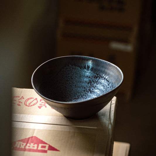 Large Japanese black bowl with irregular edges