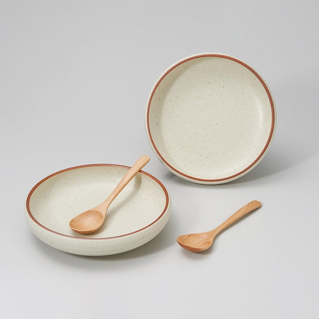 Set of two plates with wooden spoon