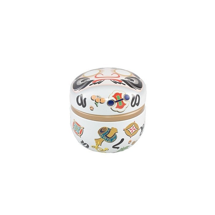 Boîte à thé Yugen lab en fer blanc avec motifs de daruma japonais traditionnels sur fond blanc