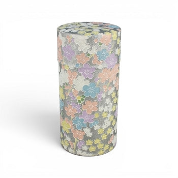 Boîte à thé Yugen lab cylindrique en fer et papier washi avec motifs de fleurs pastel sur fond argenté