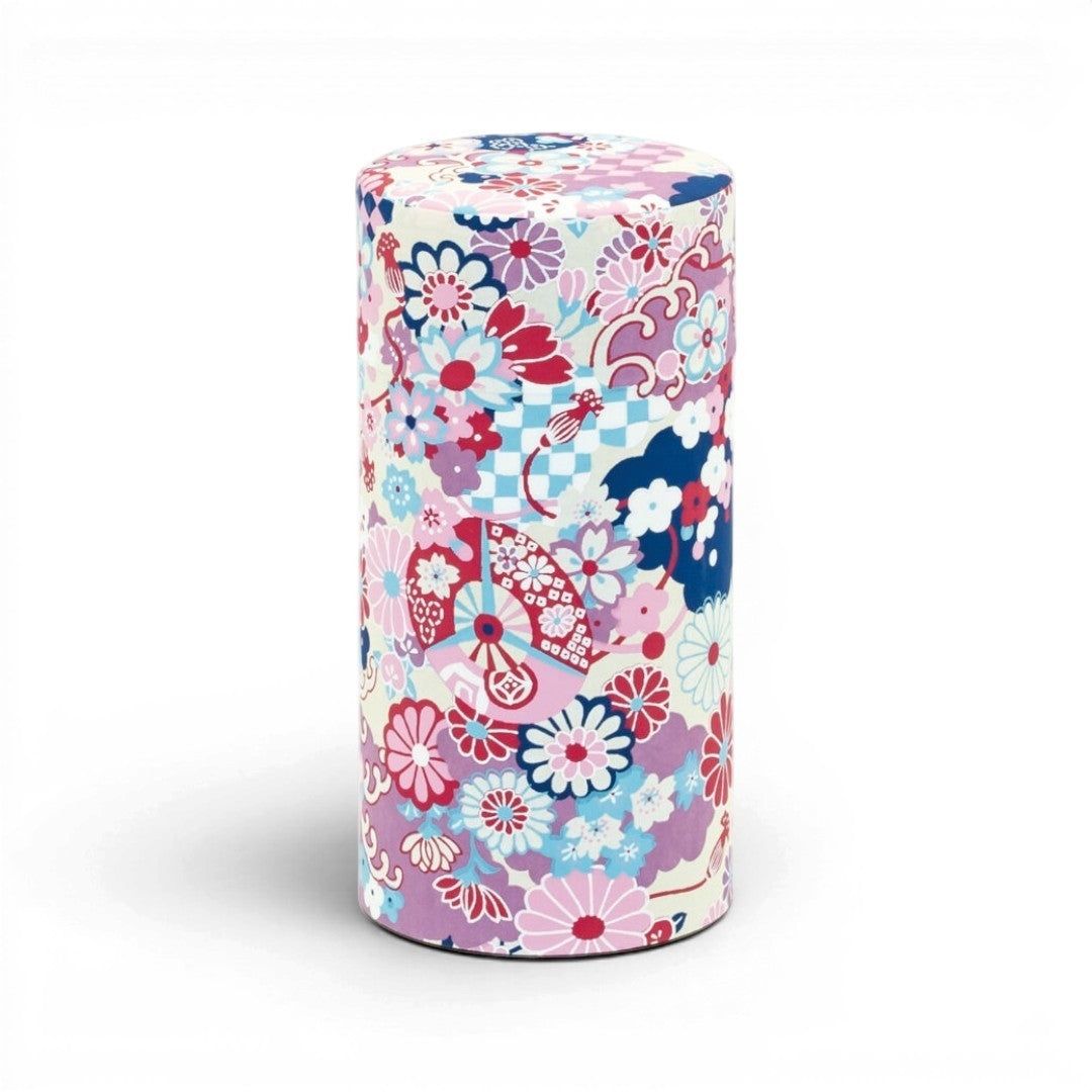 Boîte à thé japonaise Yugen lab cylindrique avec motif floral violet et détails géométriques colorés