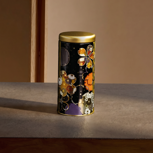 Boîte à thé Yugen lab cylindrique en fer blanc noir avec motifs floraux japonais colorés et détails dorés