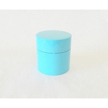 Boîte à thé japonaise Yugen lab en résine turquoise au design cylindrique minimaliste et surface lisse