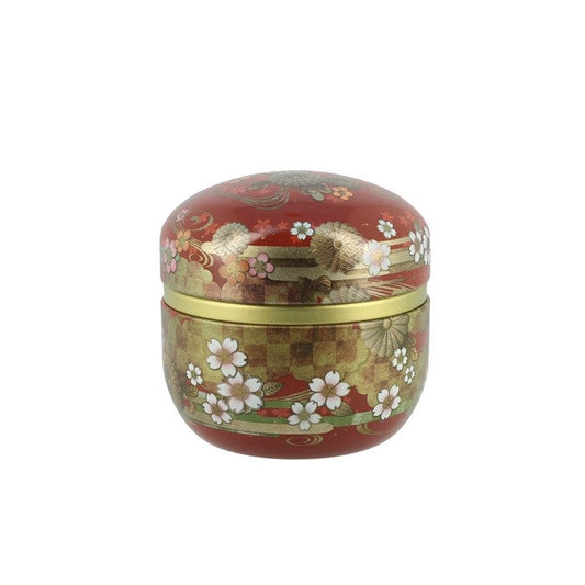 Boîte à thé ronde Yugen lab rouge avec motifs floraux japonais dorés et blancs pour conserver les feuilles de thé