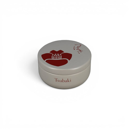 Boîte à thé Yugen lab Tsubaki ronde en métal gris avec motif de fleur de camélia rouge et inscription japonaise