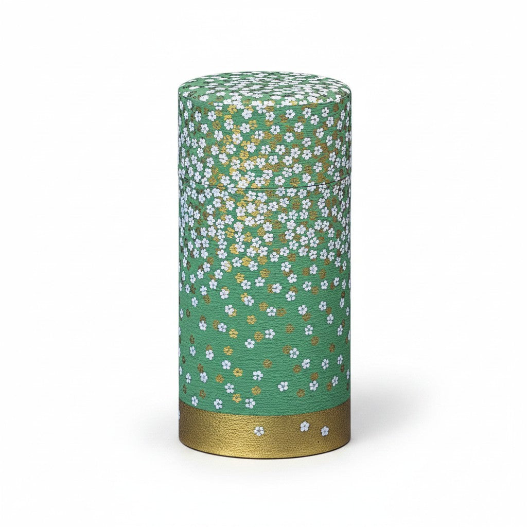 Boîte à thé Yugen lab cylindrique en fer blanc et papier washi vert avec motif floral blanc et base dorée