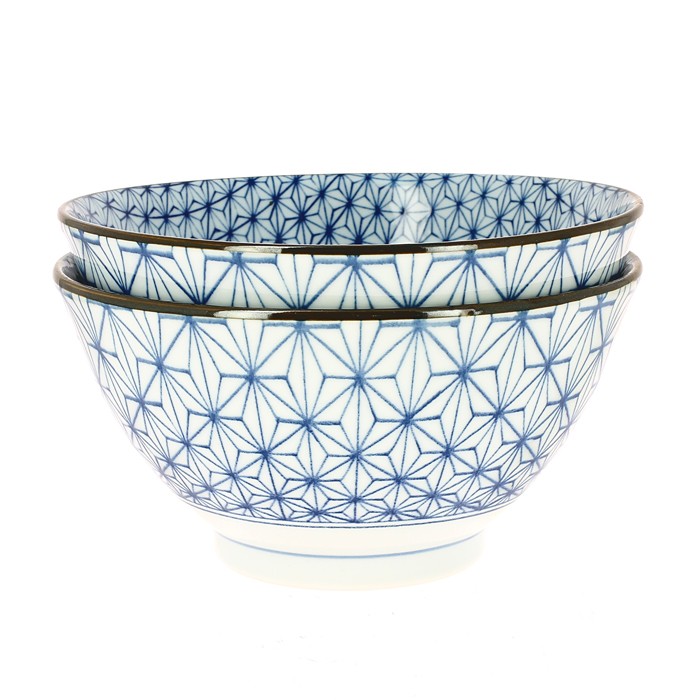 Two stacked Japanese porcelain ramen bowls with blue asanoha pattern, on a white background