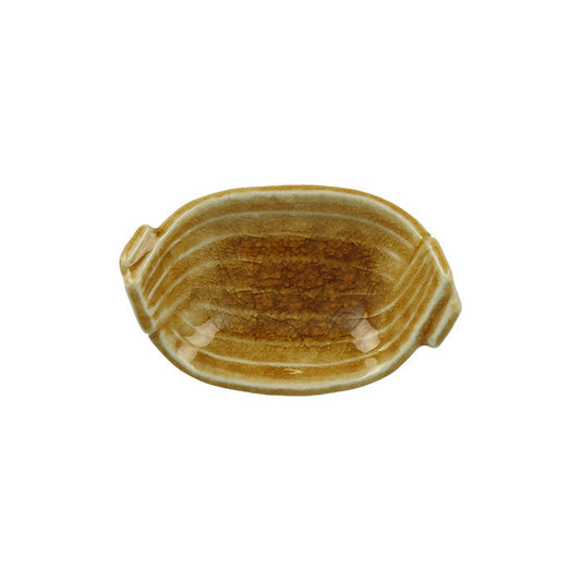 Japanese ceramic woven basket dish with amber and honey glaze, on a white background