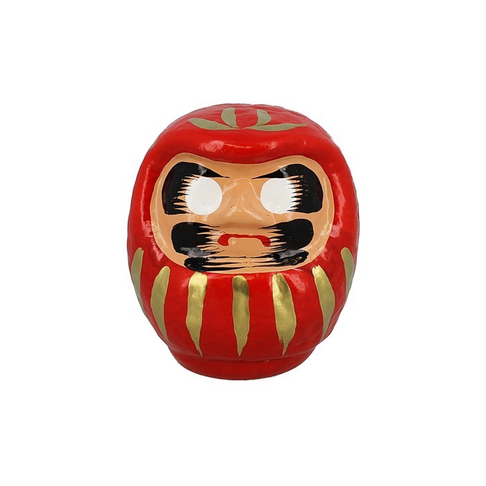 Amulette japonaise Daruma rouge en papier mâché par Yugen lab, symbole de chance et de persévérance.