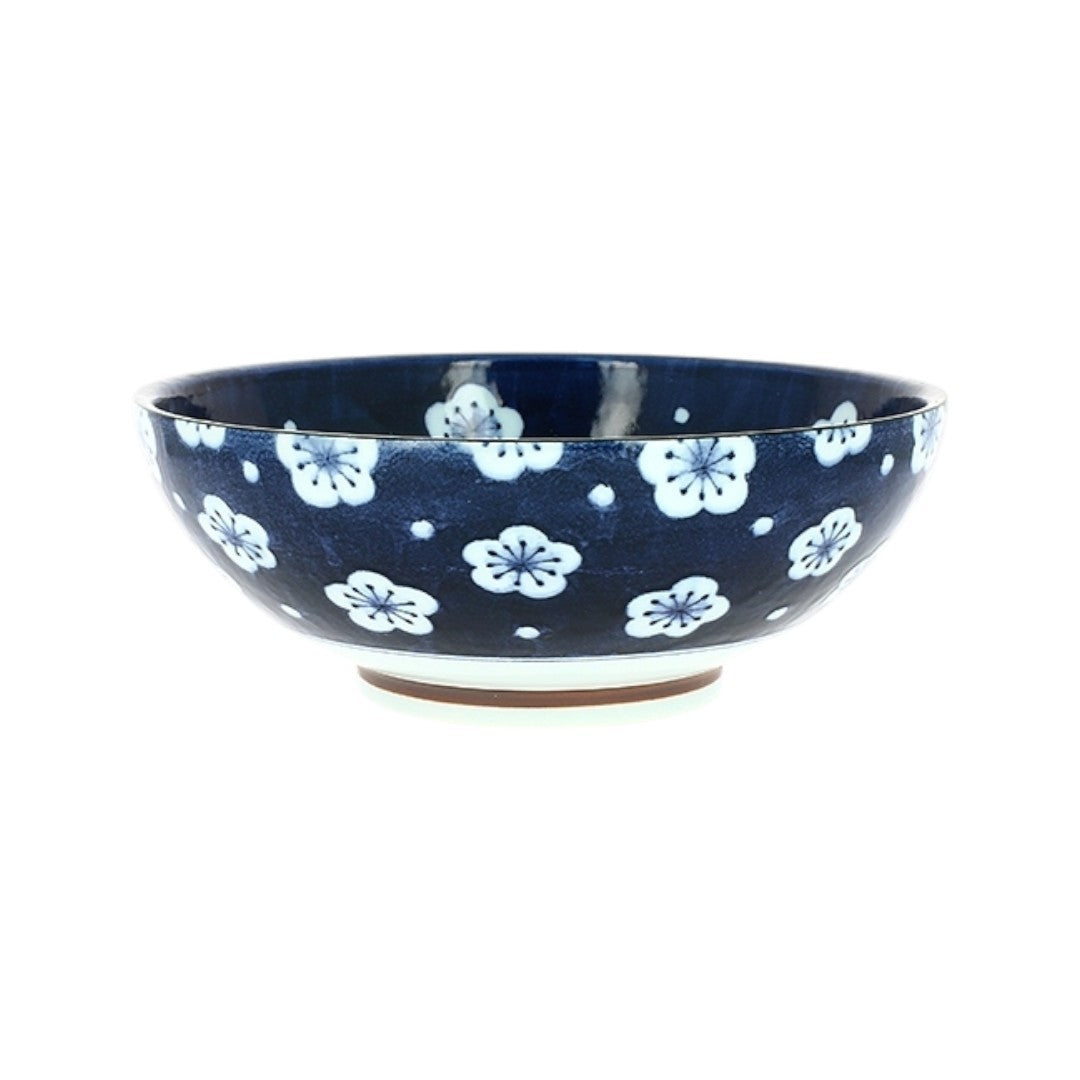 Saladier Yugen lab en céramique bleu profond orné de motifs floraux blancs délicats pour une table japonaise élégante